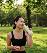 a women in a park with a Modern Dose water bottle - www.moderndose.com