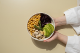 healthy bowl of food with avocado, beets, chickpeas, chicken