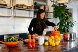 woman in a kitchen cooking a healthy meal