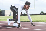 man ready to run at the start line on a race track