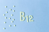 b12 tablets with a light blue background