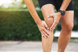 Close up athlete man, Knee pain after exercise. It happens often in athletes practice overtrain.
