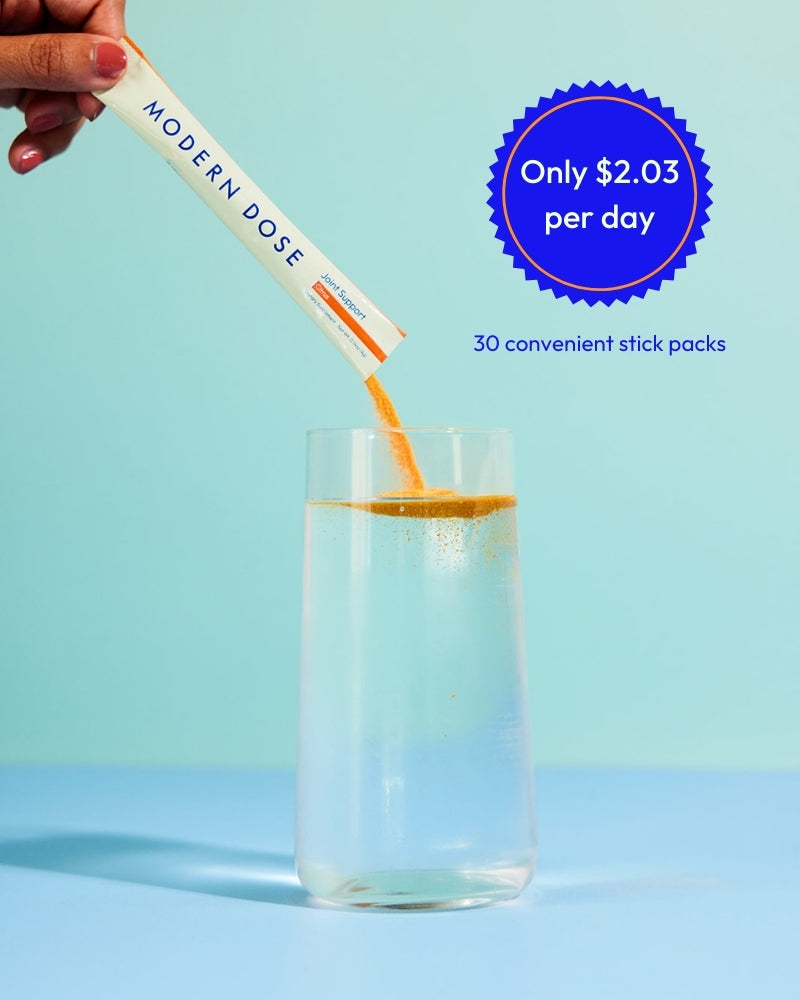 Modern Dose Citrus Joint Support supplement stick pack being poured into a glass with price and quantity information on a blue background - www.moderndose.com