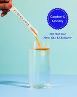 Modern Dose Joint Support stick pack being added to a glass of water with a blue background and text about comfort and mobility.