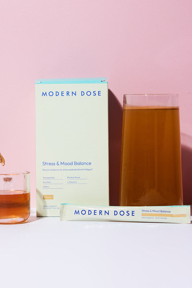 Modern Dose Stress & Mood Balance in Honey box, stick pack, and drink surrounded by honey - www.moderndose.com