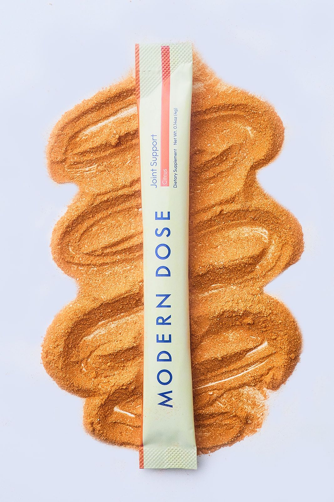 Modern Dose Joint Support Citrus stick pack laying on its powder - www.moderndose.com