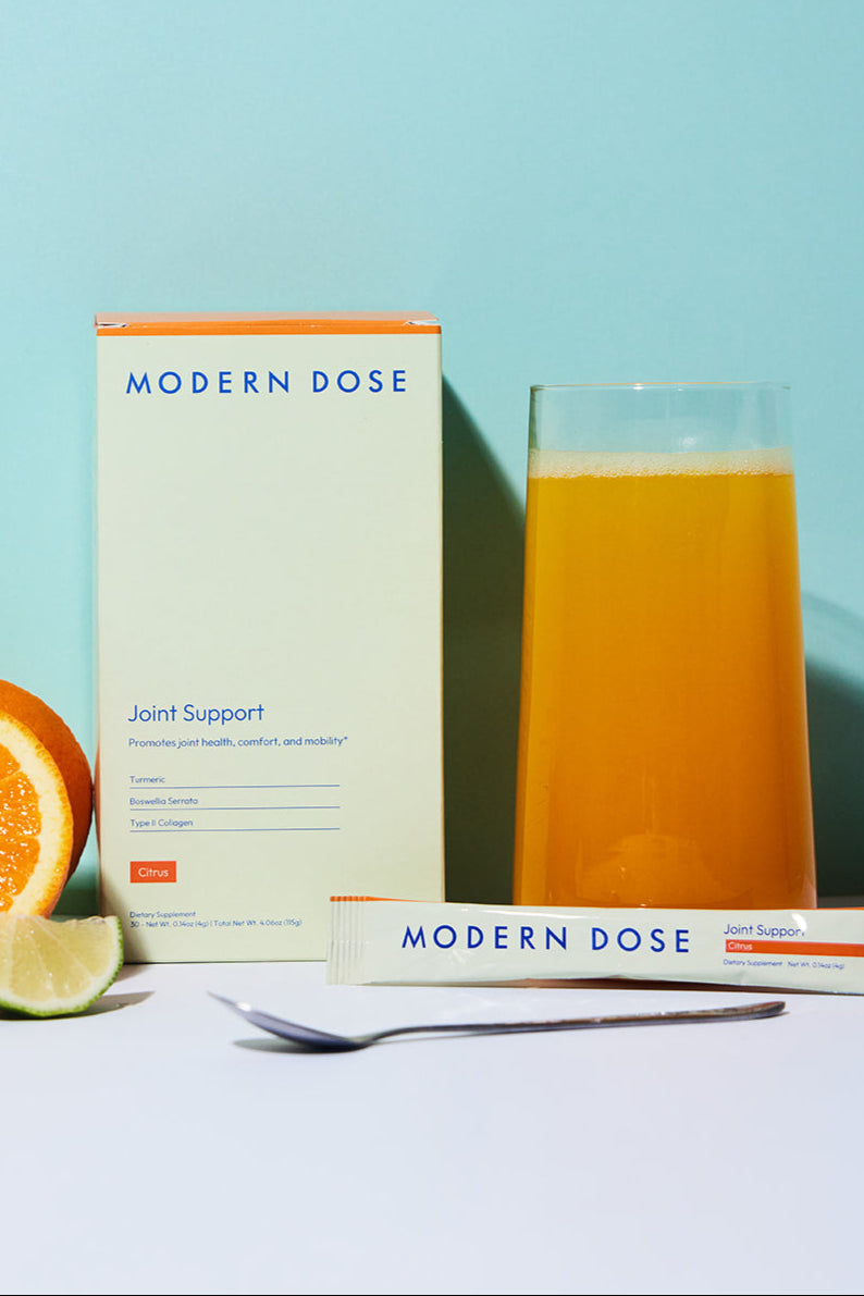 Modern Dose Joint Support box, stick pack, and drink with limes and oranges and a spoon - www.moderndose.com